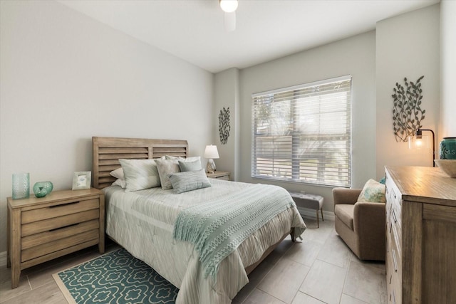 bedroom featuring ceiling fan and baseboards