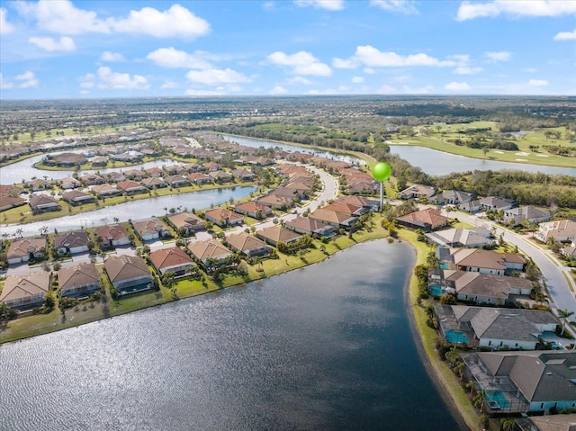 bird's eye view with a residential view and a water view