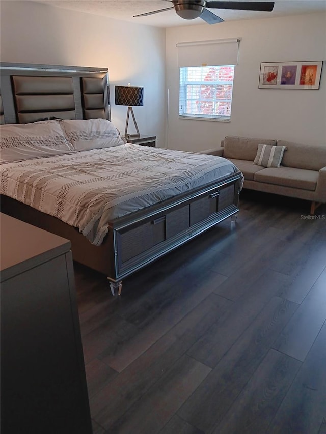 bedroom featuring dark hardwood / wood-style floors and ceiling fan