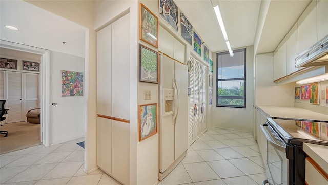 hallway with light tile patterned floors