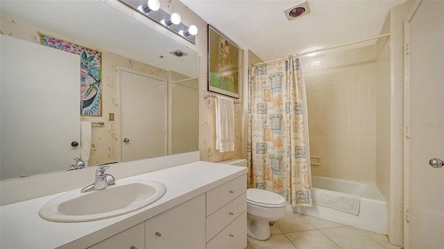 full bathroom with vanity, toilet, tile patterned floors, and shower / bath combo