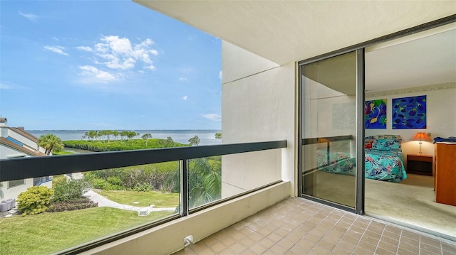 balcony featuring a water view