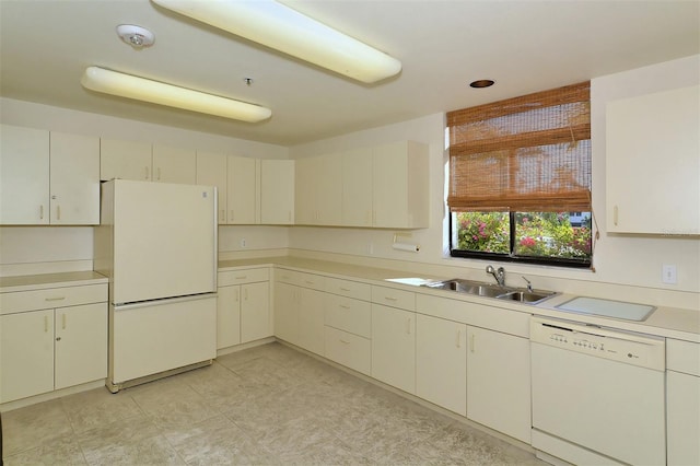 kitchen with sink and white appliances