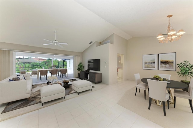 living area with light tile patterned flooring, ceiling fan with notable chandelier, visible vents, and high vaulted ceiling