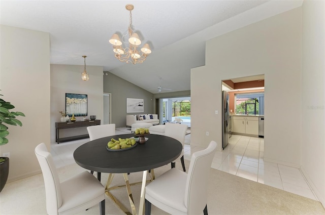 dining area with a chandelier, light tile patterned flooring, and vaulted ceiling