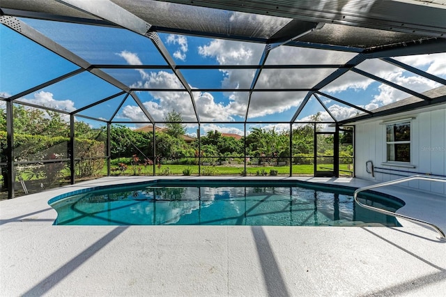 outdoor pool featuring a patio area and a lanai