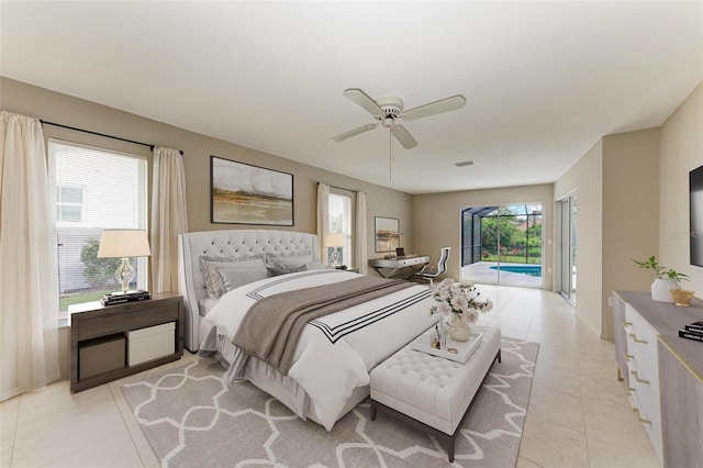 bedroom featuring access to exterior, light tile patterned floors, visible vents, and ceiling fan