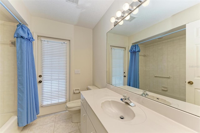 full bathroom featuring toilet, shower / bath combo, a textured ceiling, tile patterned flooring, and vanity