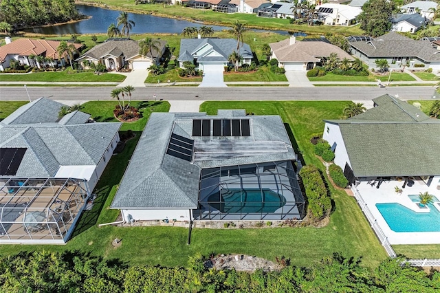 aerial view with a residential view and a water view