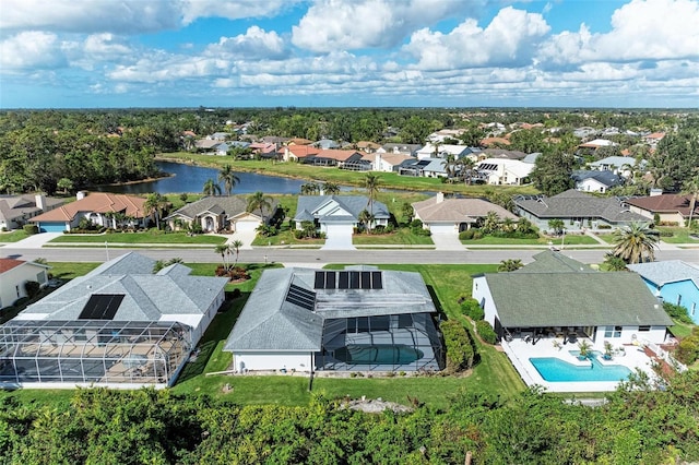 aerial view featuring a residential view and a water view