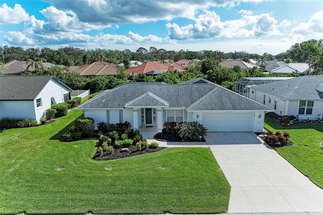 ranch-style home with a residential view, an attached garage, concrete driveway, and a front yard