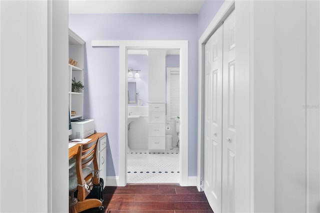 hallway with dark hardwood / wood-style floors