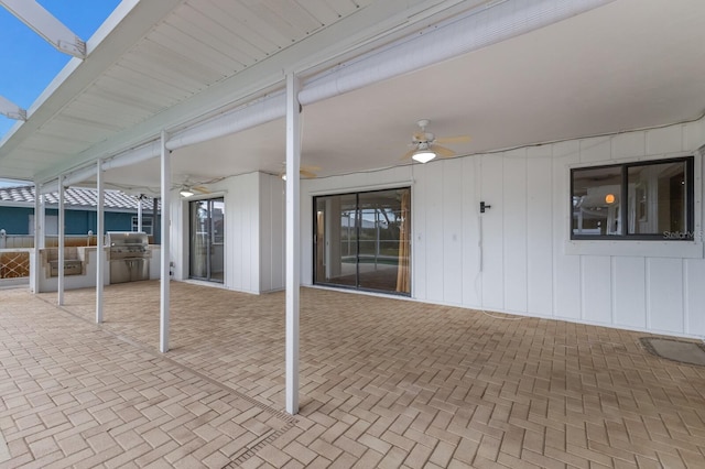 view of patio featuring ceiling fan, a grill, and area for grilling