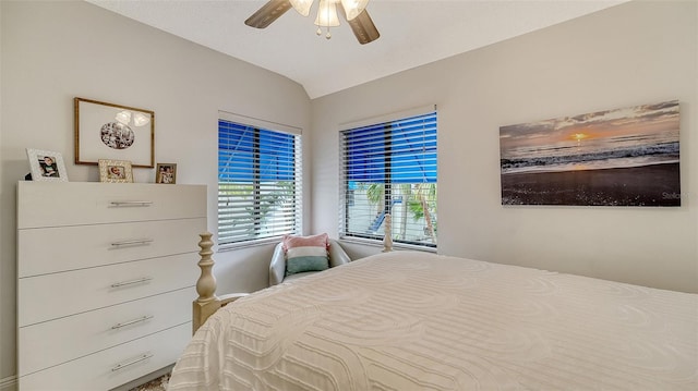 bedroom featuring ceiling fan and vaulted ceiling