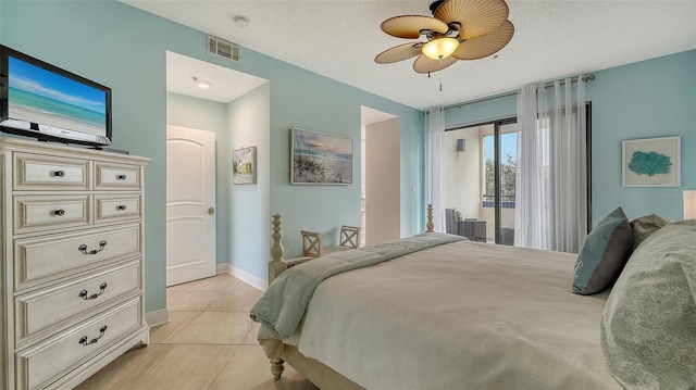 tiled bedroom featuring a textured ceiling, access to outside, and ceiling fan