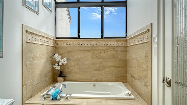 bathroom featuring a relaxing tiled tub