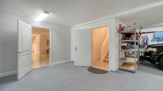 interior space featuring a textured ceiling