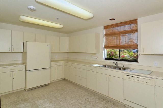 kitchen with sink and white appliances