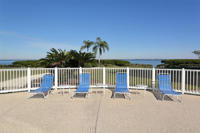 view of patio with a water view