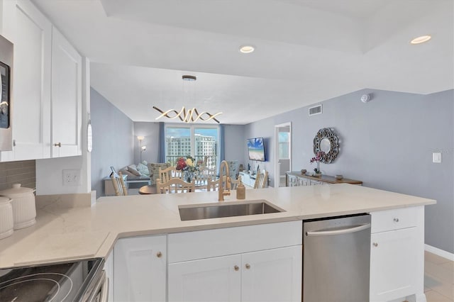 kitchen with white cabinetry, dishwasher, sink, hanging light fixtures, and kitchen peninsula