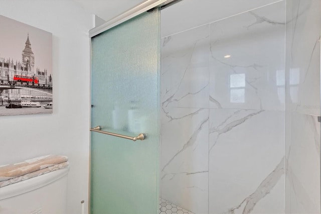 bathroom with toilet and an enclosed shower