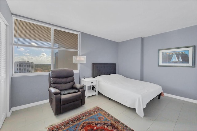 bedroom featuring light tile patterned floors