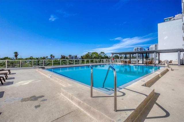 view of pool featuring a patio