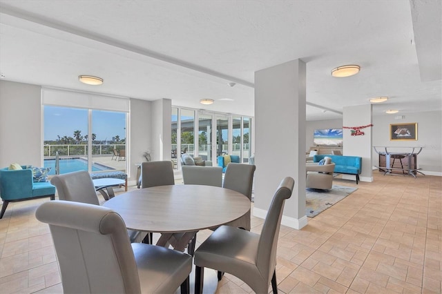 dining area featuring a textured ceiling