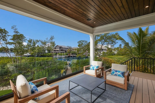 view of patio featuring a water view and an outdoor hangout area