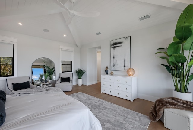 bedroom featuring vaulted ceiling with beams, ceiling fan, dark hardwood / wood-style flooring, and wooden ceiling