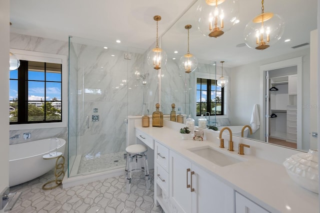 bathroom with vanity, plus walk in shower, and a wealth of natural light