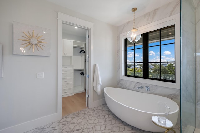 bathroom featuring a tub to relax in