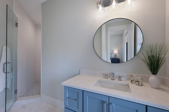 bathroom with vanity and a shower with shower door