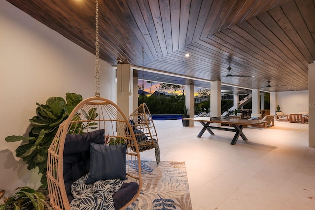 interior space with ceiling fan