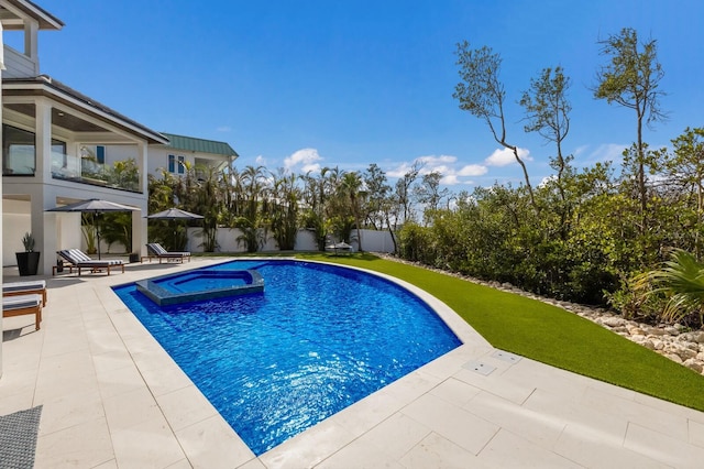 view of pool featuring an in ground hot tub and a patio