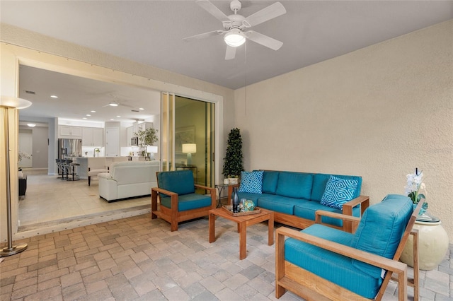 living room featuring ceiling fan