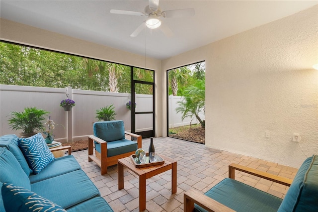 sunroom / solarium with ceiling fan