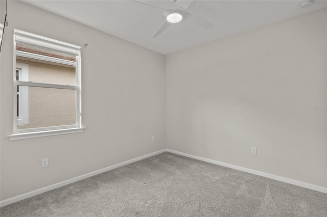 unfurnished room with carpet flooring and ceiling fan