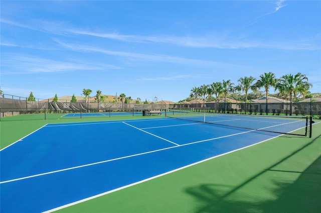 view of sport court with basketball hoop