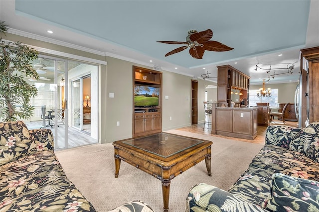 carpeted living room with crown molding and ceiling fan with notable chandelier