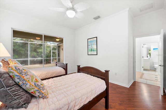 bedroom featuring connected bathroom, ceiling fan, crown molding, and dark wood-type flooring