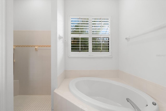 bathroom featuring plus walk in shower