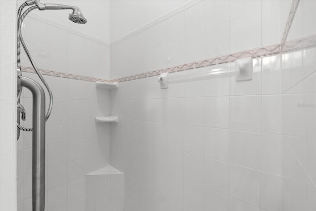 bathroom with a tile shower