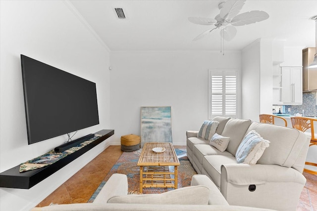 tiled living room with crown molding and ceiling fan