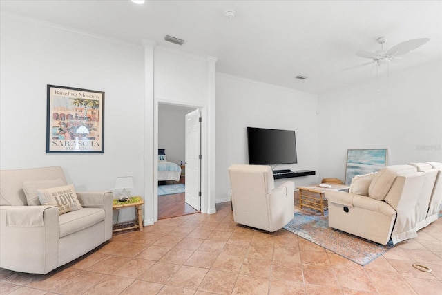 living room featuring ceiling fan and ornamental molding