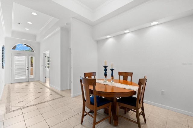 108 Corte Del Rosa, Venice, FL 34285 - dining space featuring a tray ceiling, light tile patterned floors, recessed lighting, and ornamental molding
