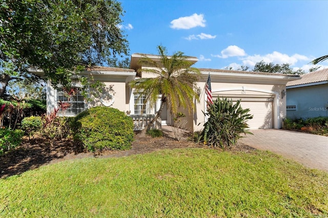 view of front facade featuring a front yard and a garage