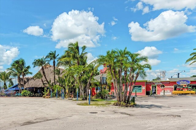 108 Corte Del Rosa, Venice, FL 34285 - view of building exterior featuring uncovered parking