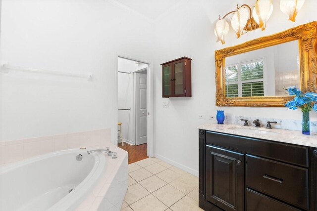 108 Corte Del Rosa, Venice, FL 34285 - full bath with vanity, a garden tub, tile patterned flooring, and ornamental molding