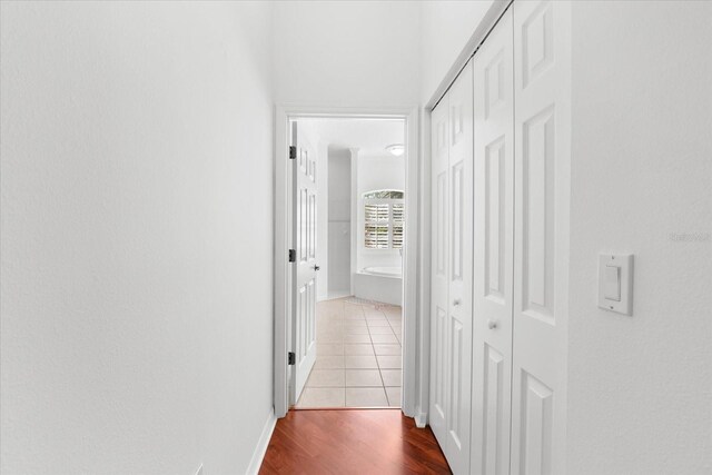 108 Corte Del Rosa, Venice, FL 34285 - hall featuring wood finished floors and baseboards